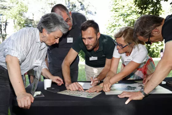 Group of professors discussing outside